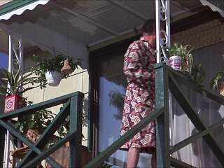 Blonde with big tits on the lawn